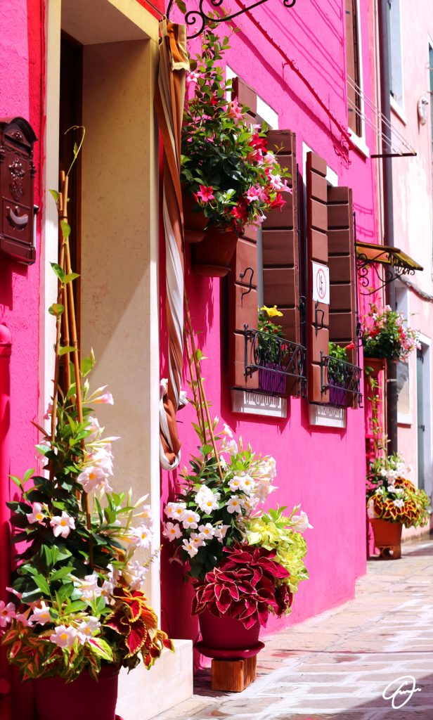A New Beginning artwork by Fabio Dal Boni – colorful pink house with flowers in Burano, Venice, Italy